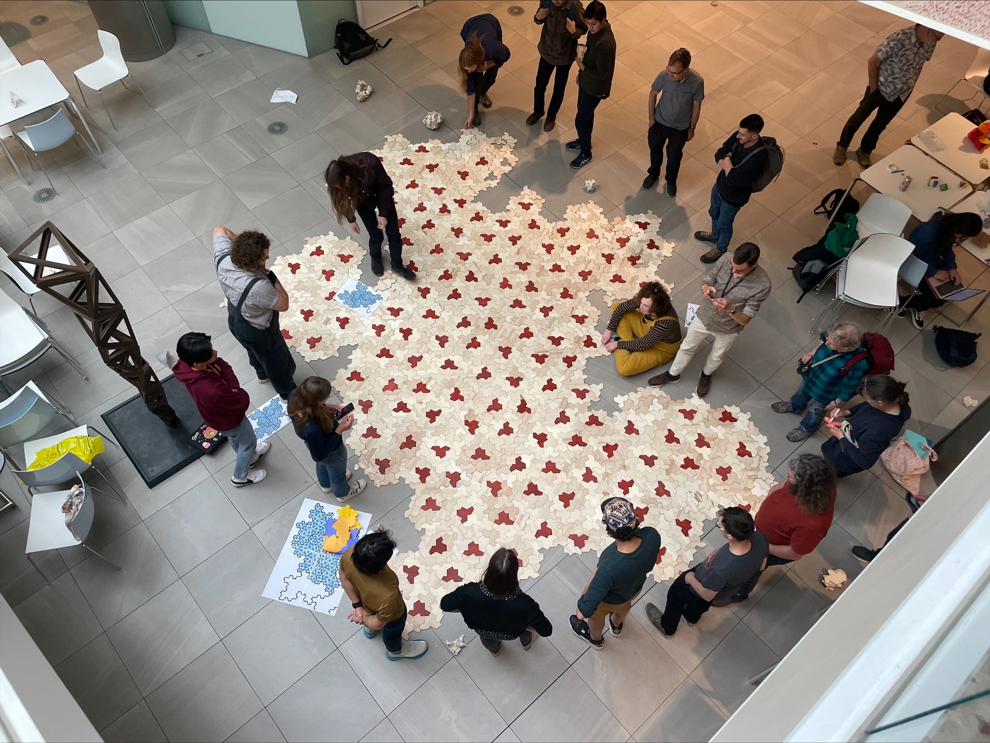 Photo of tiling being built by a group of people