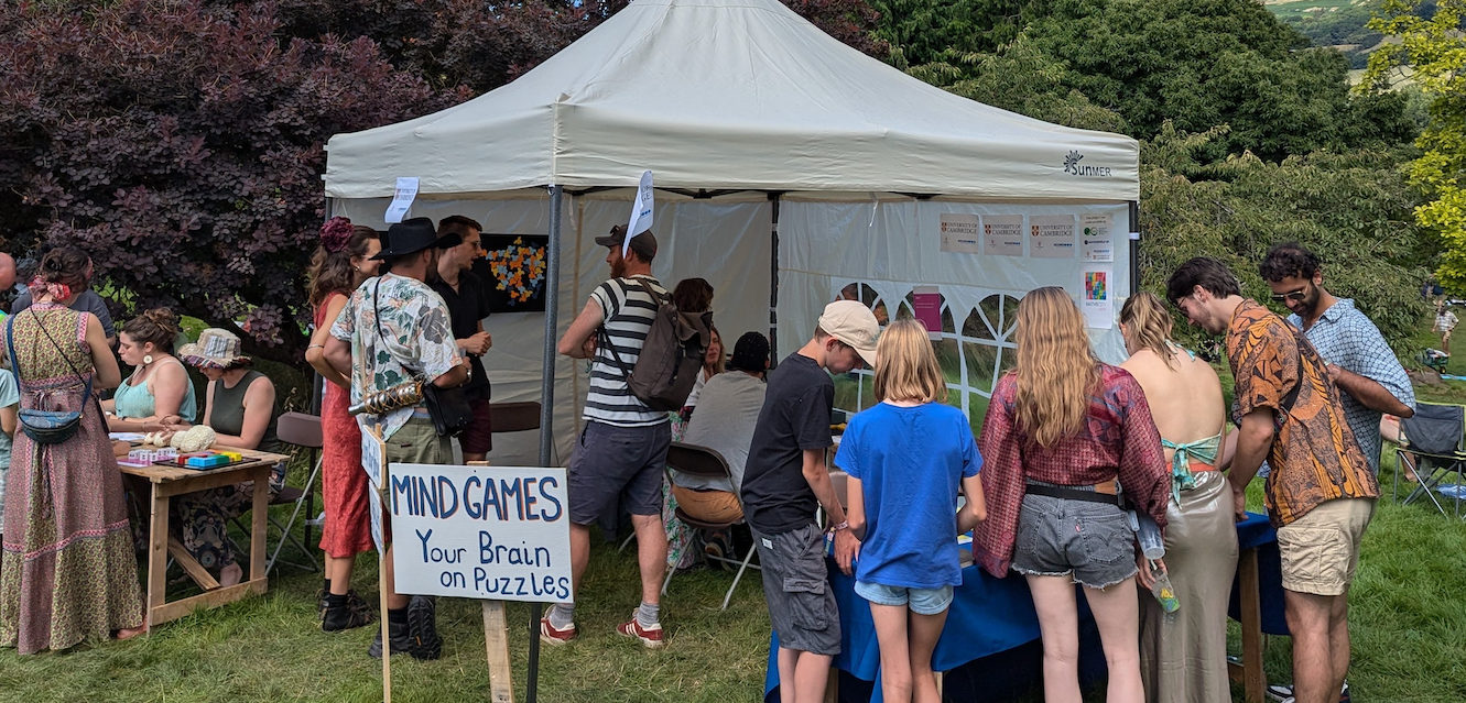 Photo of a stall at a festival, with a sign that says 